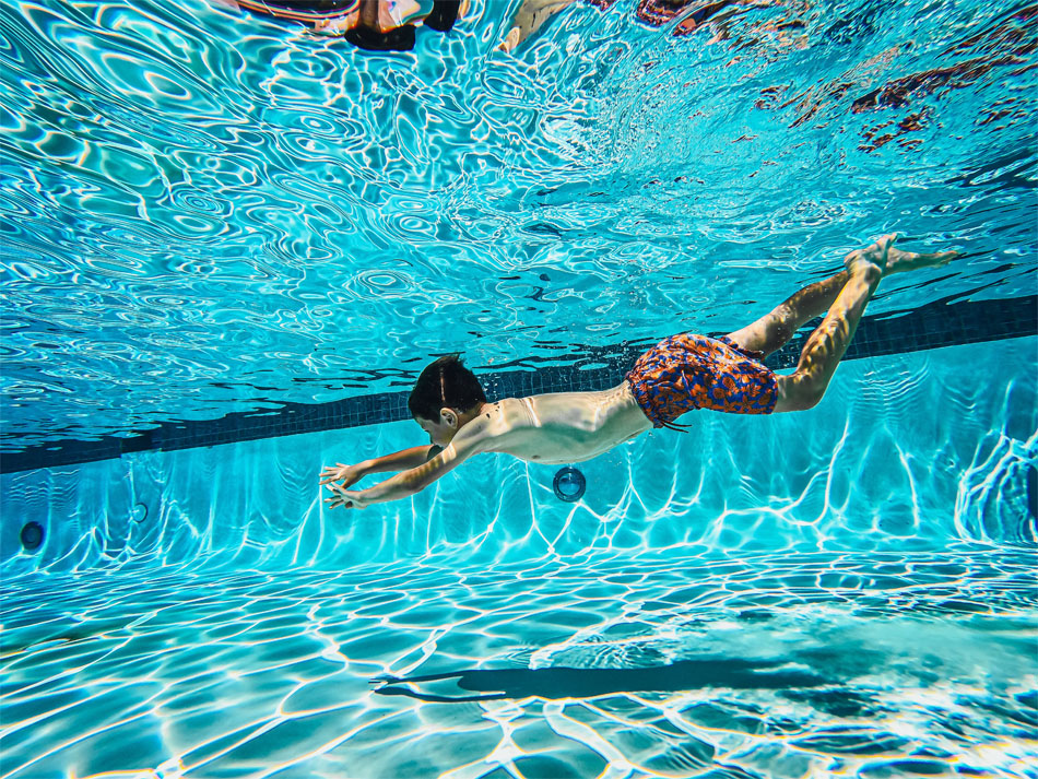 Boy swimming in a swimming pool